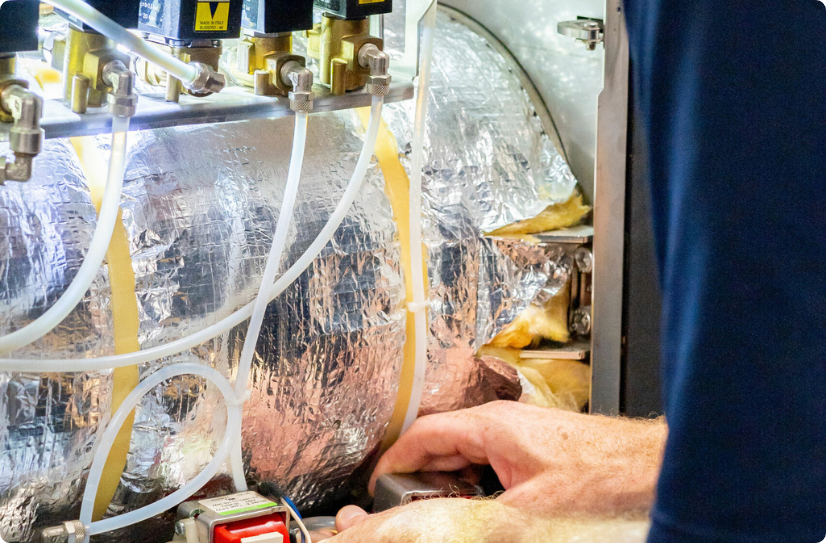 A man fixing an equipment at a veterinary practice.